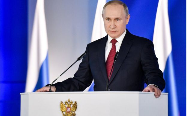 Russia's President Vladimir Putin delivers an annual address to the Federal Assembly of the Russian Federation, at Moscow's Manezh Central Exhibition Hall on 15 Jan
