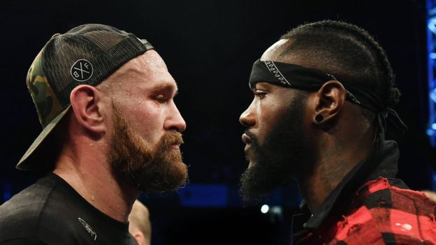 Heavyweight Tyson Fury is confronted by rival boxer Deontay Wilder