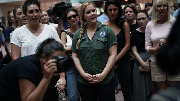 Comedian Amy Schumer (C) joins a protest on Capitol Hill