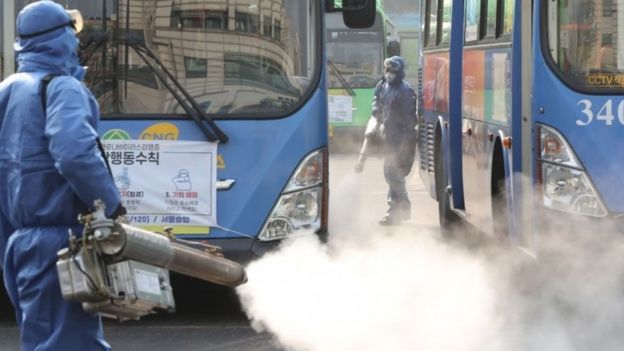 Workers spray disinfectant at a bus terminal in Seoul, South Korea. Photo: 20 February 2020