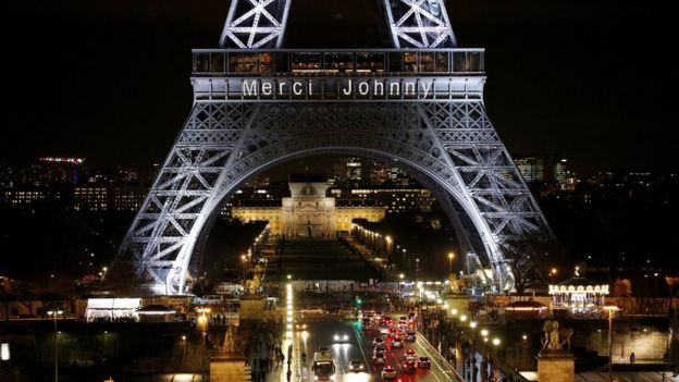 The Eiffel Tower in Paris is illuminated with the message 