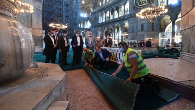 Head of Turkey's Religious Affairs Directorate Ali Erbas visits Hagia Sophia or Ayasofya-i Kebir Camii as workers lay carpets in Istanbul on 22 July