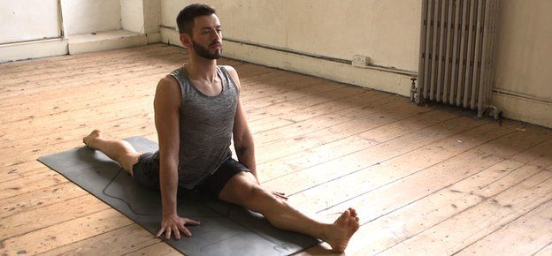 A man doing the splits