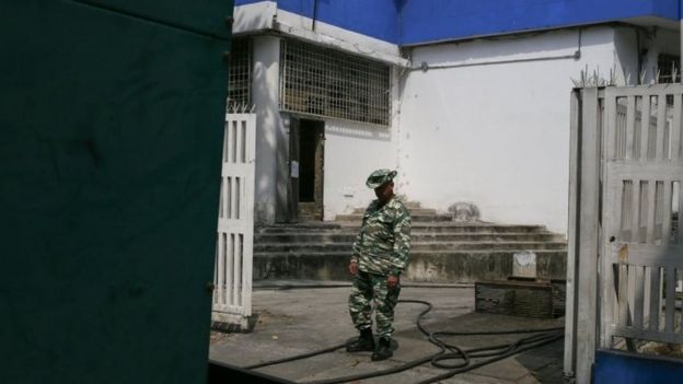 The generator of the JM de Los Ríos children's hospital in Caracas is patrolled by members of a government-run militia