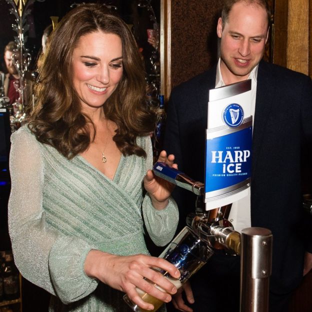 The Duke and Duchess of Cambridge pull a pint as they visit the Belfast Empire Hall in Belfast