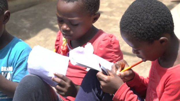 Some of Claude Ngwa being taught by a teacher at home in Douala, Cameroon