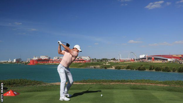 Rory McIlroy teeing off on the 18th hole at Yas LInks