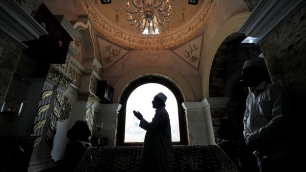 A Muslim priest prays during Eid al-Fitr to mark the end of the holy fasting month of Ramadan at Dewatagaha Mosque in Colombo, Sri Lanka on 24 May 2020