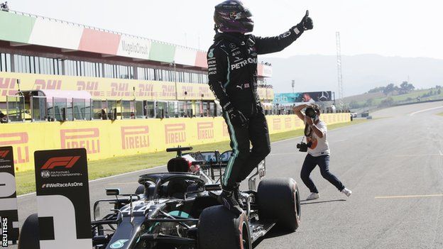 Lewis Hamilton celebrates pole position at Mugello