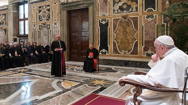 Pope Francis listens to Archbishop Paglia