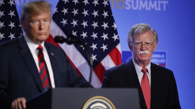 President Donald Trump, flanked by National Security Advisor John Bolton, speaks to the media at a press conference on the second day of the 2018 NATO Summit on July 12, 2018 in Brussels