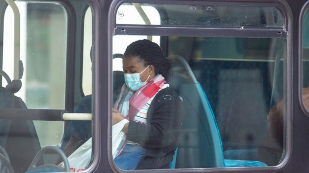 A passenger wearing a protective face mask on a bus in central London, following the announcement that wearing a face covering will be mandatory for passengers on public transport in England