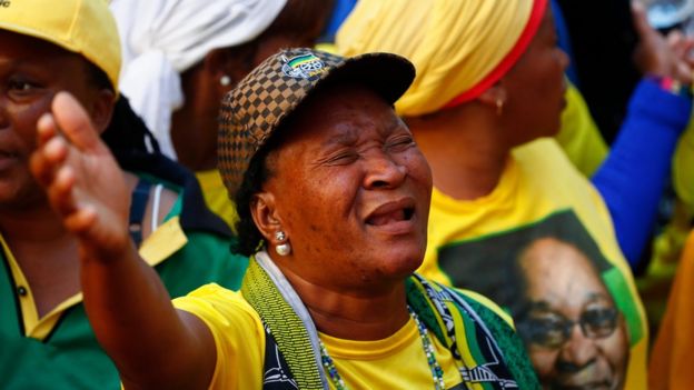 Protesters from the ruling party African National Congress (ANC) dance and sing in support of South African president Jacob Zuma outside parliament in Cape Town, South Africa, 08 August 2017.