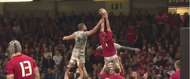 Kruis (number five) illegally impedes Hill (four)