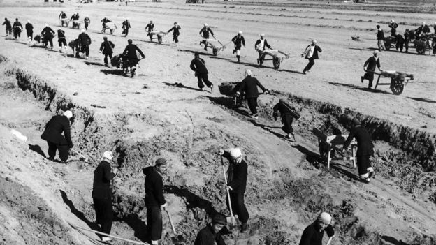 In February 1958, During The 'Great Leap Forward', Inhabitants Of The City Of Yang-Kula In Shantung Province, China, Toil Away At Building A Water Reservoir To Irrigate And Drain The Fields.