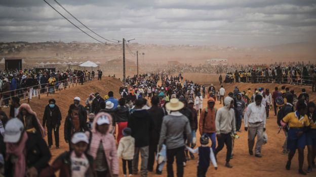 People walking to Mass with pope