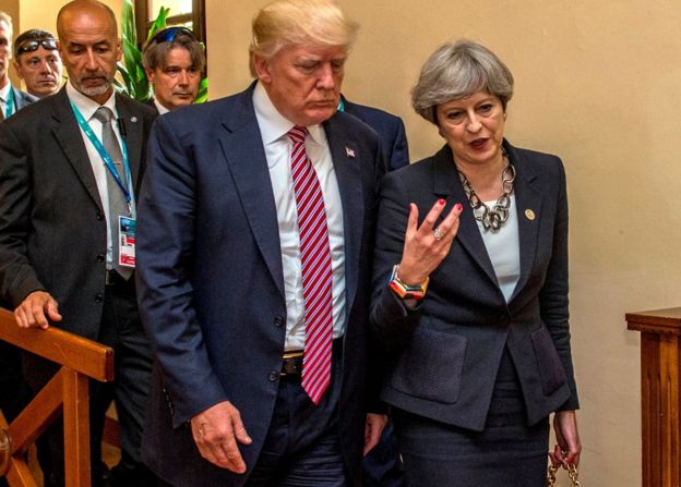 US President Donald Trump walks with UK Prime Minister Theresa May at the G7 summit in Taormina, Sicily, 26 May