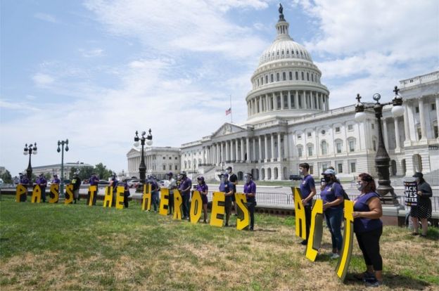 Protesters outside the capitol building in Washington call for a second stimulus bill