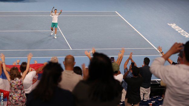 Novak Djokovic celebrates with fans on Rod Laver Arena
