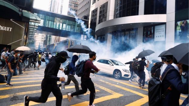 Protesters running from tear gas in central Hong Kong