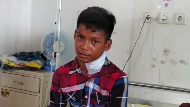 Muhammad Idul sitting in hospital