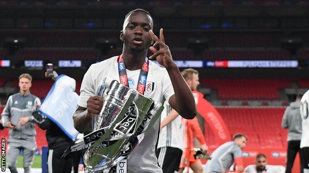 DR Congo's Neeskens Kebano celebrates with the Enlgish Championship play-off trophy