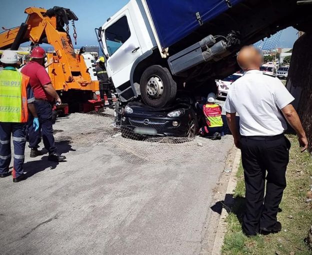A picture of the truck that landed on top of a car in the South African city of Port Elizabeth