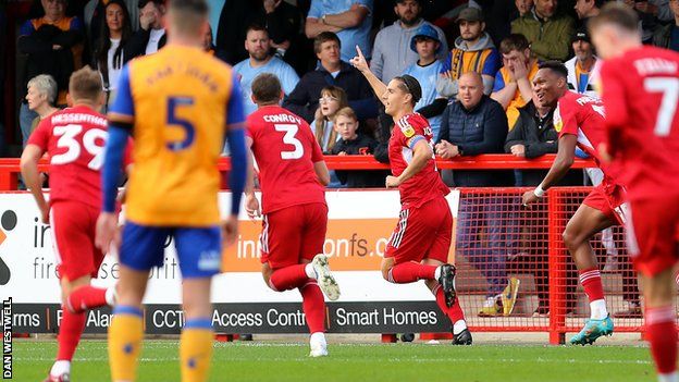 Tom Nichols celebrates scoring Crawley Town's second goal against Mansfield Town