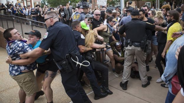 Officers clash with counter protestors after the Ku Klux Klan held a rally in Charlottesville, Virginia. 8 July 2017