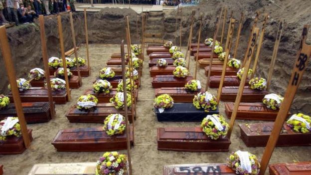 Coffins are lined up at a mass funeral for victims two days after the deadly Mandala Airlines plane crash in Medan, Indonesia (07 September 2005)