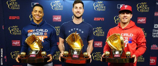 Jeremy Pena, Kyle Tucker and JT Realmuto with their Gold Glove awards