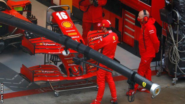 Charles Leclerc outside the Ferrari garage