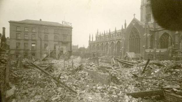 Archive image of Holy Trinity Church with piles of rubble in front left by bomb damage