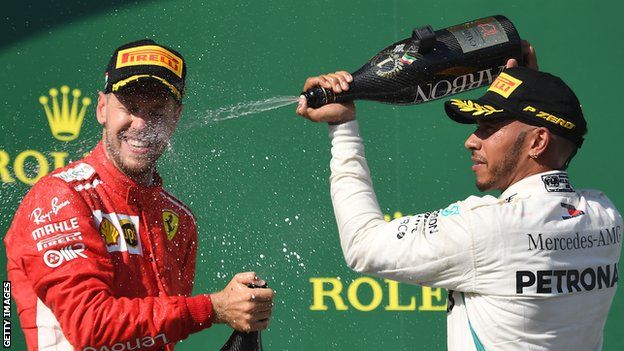 Sebastian Vettel and Lewis Hamilton spray champagne at the Hungarian GP