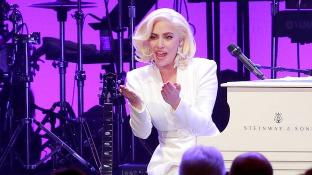 Lady Gaga acknowledges the five former U.S. presidents during the concert