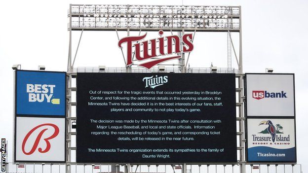 A sign at Minnesota Twins' Target Field stadium with a statement explaining the MLB side's decision to postpone their game against the Boston Red Sox