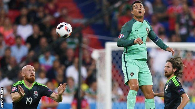 Cristiano Ronaldo leaps and heads the ball into the back of the net for Portugal in the Euro 2016 semi-final.