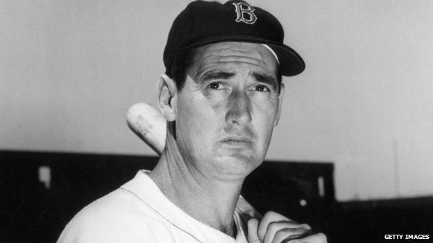 Baseball legend Ted Williams (1918 - 2002) of the Boston Red Sox holds a baseball bat at Shriner's Day in Fenway Park 22 August 1958 in Boston, Massachusetts