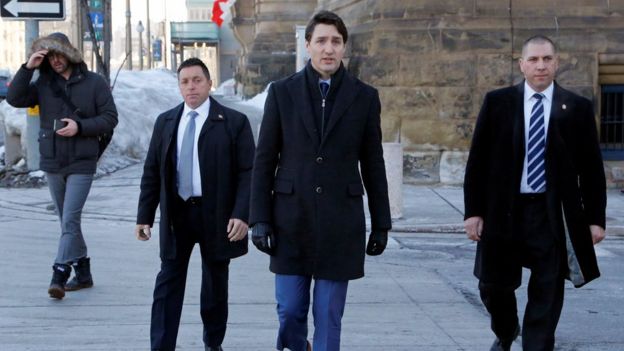 Canada's Prime Minister Justin Trudeau (centre)