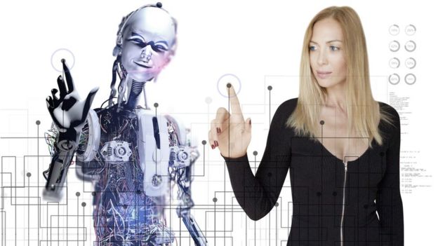 Woman and robot working together on touch screen