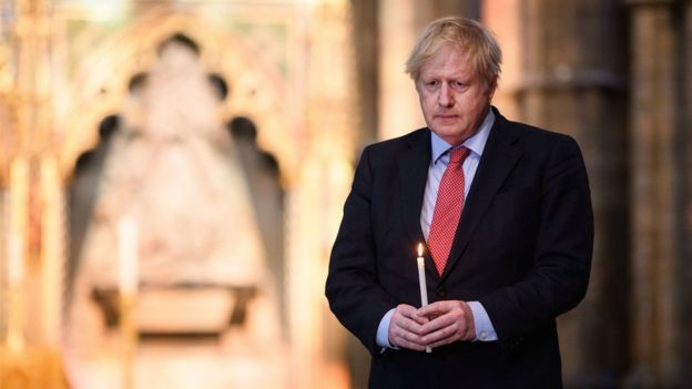 Prime Minister Boris Johnson prepares to light a candle at the Grave of the Unknown Warrior in Westminster Abbey in London, ahead of commemorations to mark the 75th anniversary of VE Day
