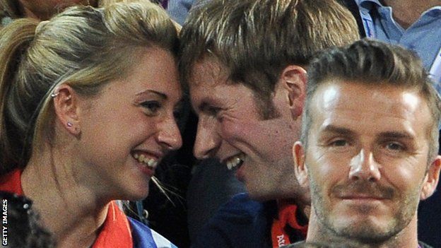 Laura Trott, Jason Kenny and David Beckham watching the beach volleyball during the London 2012 Olympics