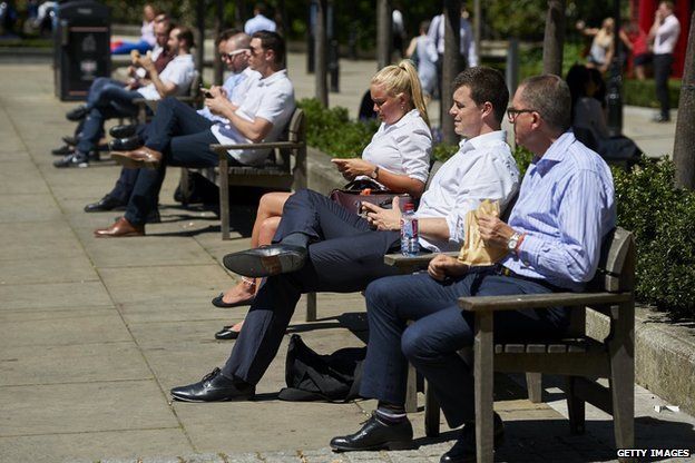 City workers enjoy the sunshine in central London on 30 June