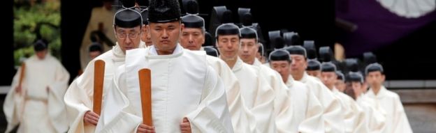 Shinto priests attend a ritual during an autumn festival at the Yasukuni Shrine in Tokyo