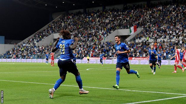 Italy's players celebrate scoring against Lithuania in a World Cup qualifier