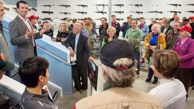 Mr Trump campaigns for his father at a gun store in Maine in 2016