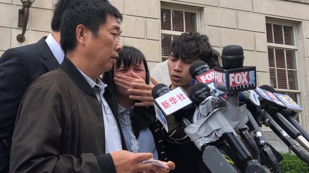 Ronggao Zhang, father Yingying Zhang, reads a statement on behalf of the family outside court