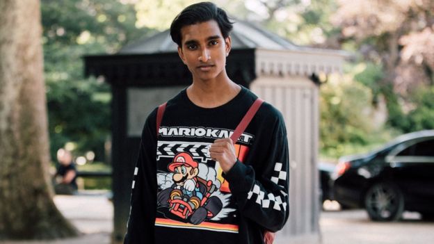 Jeenu Mahadevan wears a black Mario Kart shirt during Mens Fashion Week in Paris. He says he is one of the few dark-skinned South Asian models in the fashion world