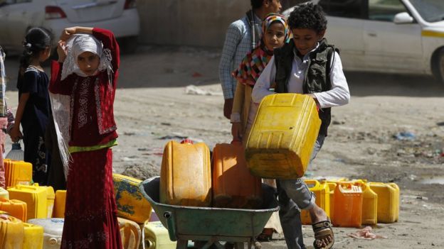 Children collect safe drinking water in Sanaa, Yemen