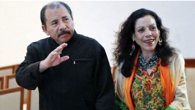 Nicaraguan President Daniel Ortega (left) next to his wife Rosario Murillo (04 December 2013)